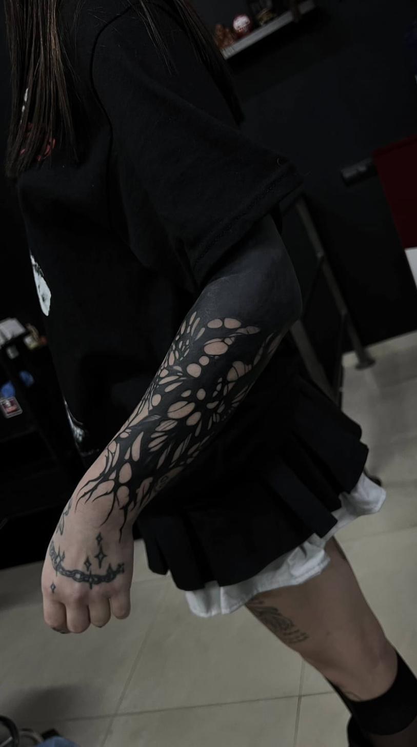 Blackwork tattoo Uppsala — organic dotwork pattern on forearm