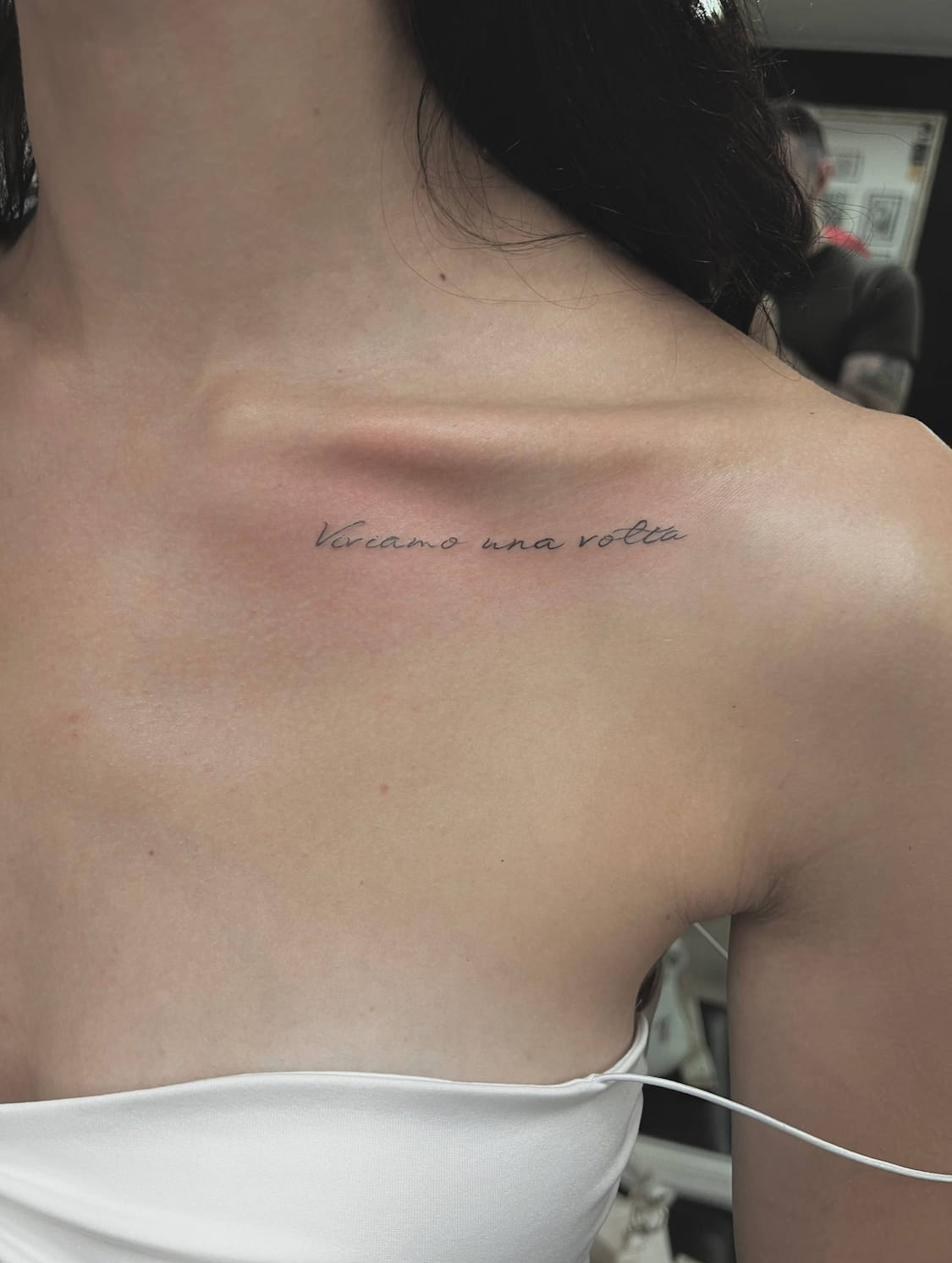 Fine line lettering tattoo Uppsala — text on collarbone