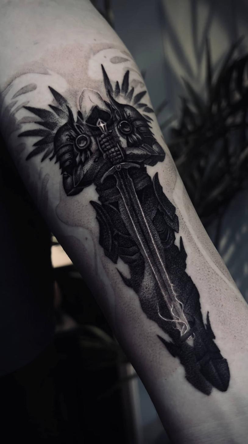 Dark fantasy tattoo Uppsala — knight with sword, forearm
