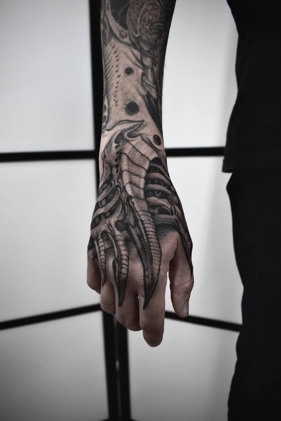 Biomechanical tattoo near Stockholm — realism on hand and forearm